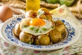 Baked potato with chili and fried egg Royalty Free Stock Photo