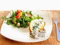 Baked foil potato with mixed salad and sauce