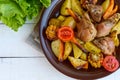 Baked potato with pieces roast goose, vegetables and corn grill. Royalty Free Stock Photo