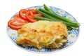 Baked potato pudding with tomato and spring onion Royalty Free Stock Photo