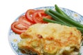 Baked potato pudding with tomato and spring onion Royalty Free Stock Photo