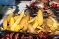 baked potato slices in the peel, street trade during the holiday Royalty Free Stock Photo