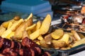 baked potato slices in the peel, street trade during the holiday Royalty Free Stock Photo