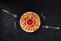 Baked potato wedges with rosemary and two forks, overhead flat lay shot Royalty Free Stock Photo