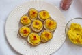 Baked potatoes with curry hummus and pepper