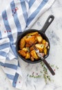 Baked potatoes with garlic and fresh thyme. Royalty Free Stock Photo