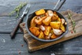 Baked potatoes with garlic and fresh thyme. Royalty Free Stock Photo