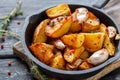 Baked potatoes with garlic and fresh thyme. Royalty Free Stock Photo