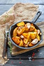 Baked potatoes with garlic and fresh thyme. Royalty Free Stock Photo