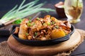 Baked potatoes with garlic, herbs and fried chanterelles