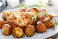 Baked potatoes with rosemary, thyme and garlic Royalty Free Stock Photo