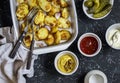 Baked potatoes and sauce him - homemade mayonnaise, ketchup and mustard. Delicious lunch or snack