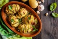 Baked potatoes stuffed with sausage, cheese, garlic and herbs