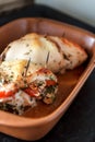 Baked poultry fillet stuffed with soft cheese, tomatoes and herb Royalty Free Stock Photo