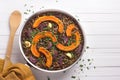 Baked pumpkin lentils with red onions and garlic in a frying pan Royalty Free Stock Photo