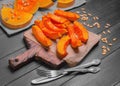 Baked pumpkin pieces on wooden board Royalty Free Stock Photo