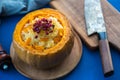 Baked Pumpkin with Rice and spices. Cut Baked Pumpkin with Rice and pomegranate with onion, sweet healthy dish. Royalty Free Stock Photo