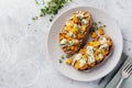 Baked pumpkin sandwich with dorblu cheese with blue mold, honey and thyme on a concrete old light background.