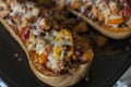 Baked pumpkin stuffed with meat, yellow bell pepper and mozzarella