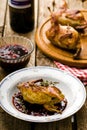 The baked quails with cowberry sauce