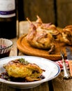 The baked quails with cowberry sauce