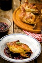 The baked quails with cowberry sauce
