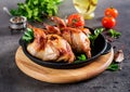 Baked quails in pan on a dark background Royalty Free Stock Photo