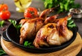 Baked quails in pan on a dark background Royalty Free Stock Photo