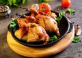 Baked quails in pan on a dark background Royalty Free Stock Photo