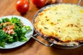 Baked quiche with field salad