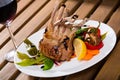 Baked rack of lamb with glass of red wine Royalty Free Stock Photo