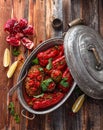 Baked red bell peppers stuffed with rice and walnuts, rustic style, copy space.