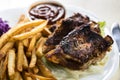 Baked ribs and French fries and cabbage salad Royalty Free Stock Photo