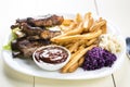 Baked ribs and French fries and cabbage salad Royalty Free Stock Photo