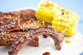 Baked ribs with sesame seeds, corn