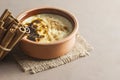 Baked rice pudding turkish dessert sutlac in earthenware casserole with cinnamon sticks Royalty Free Stock Photo