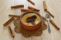 Baked rice pudding turkish dessert sutlac in earthenware casserole with cinnamon sticks Royalty Free Stock Photo