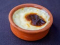 Baked rice pudding turkish milky dessert sutlac in earthenware casserole