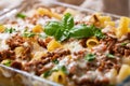 Baked rigatoni pasta with beef and green basil Royalty Free Stock Photo