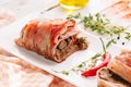 Baked roll with bacon stuffed with mushrooms Royalty Free Stock Photo