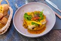 Baked saithe fillets with quinoa and curry