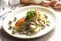 baked salmon on champignons, onion and olives