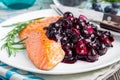 Baked salmon fillet with blueberry and rosmarin sauce, horizontal Royalty Free Stock Photo