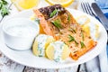 Baked salmon fillet and boiled potatoes Royalty Free Stock Photo