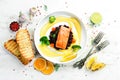 Baked salmon fillet with wild rice and vegetables. Royalty Free Stock Photo