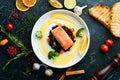 Baked salmon fillet with wild rice and vegetables. Royalty Free Stock Photo