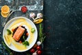 Baked salmon fillet with wild rice and vegetables. Royalty Free Stock Photo