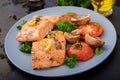 Baked salmon fish fillet with tomatoes, mushrooms and spice Royalty Free Stock Photo