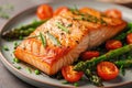 Baked salmon garnished with asparagus and tomatoes with herbs