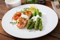 Baked salmon garnished with asparagus Royalty Free Stock Photo